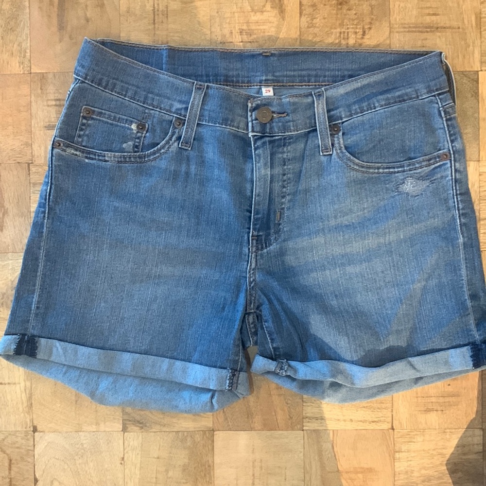 Levi’s denim shorts.  Light wash, stretch, and small distressed detail.
